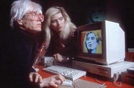 An interview with Andy Warhol, who doesn't do interviews: an artist at the Amiga launch, an artist long before Amigas. Publisher of 'Interview' magazine, pictured here with Debbie Harry